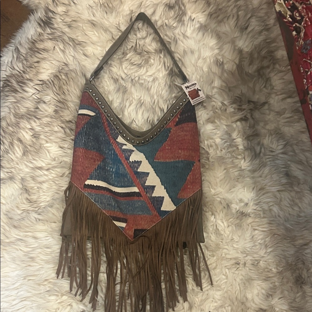 Western-Inspired Multicolor Fringe Shoulder Bag
Concealed weapons pocket